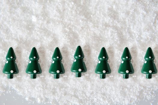 Miniature Christmas Trees on snow