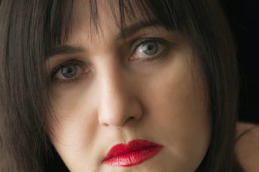 Photo of beautiful brunette with red lips