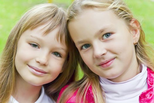 Photo of two cute girls with long hairs