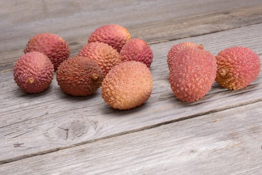 Lychee group arranged on a wooden table