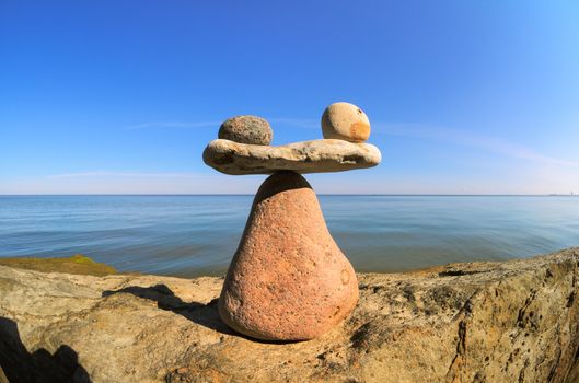 Symbol of scales on the top of boulder