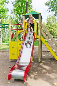 Photo of two active girls on nursery platform