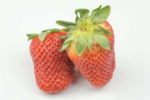 Strawberries with leaves isolated on white background