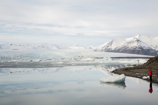 Tourist at Vatnajokull Glacier Jokulsarlon lagoon Iceland