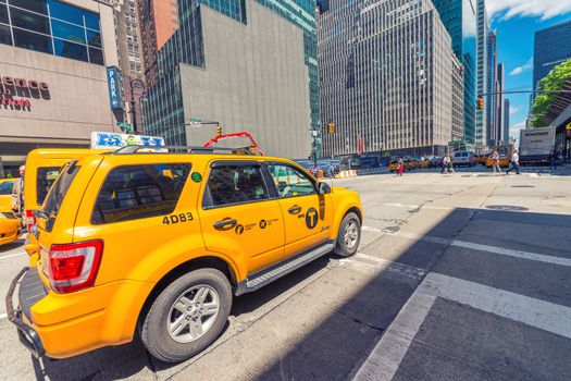 NEW YORK CITY - MAY 22, 2013: Times Square on a spring day. Approximately 330,000 people pass through Times Square daily