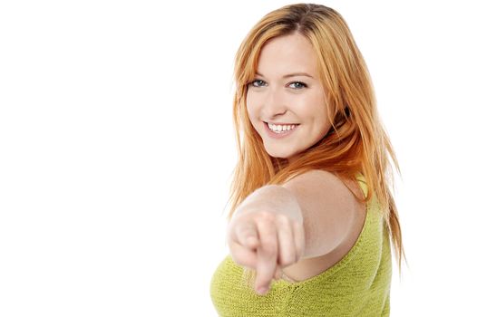 Side pose of woman pointing towards you