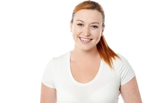 Pretty woman posing to camera over white