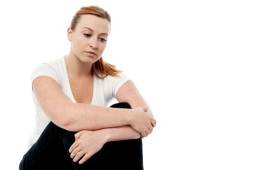 Sad woman looking thoughtful about troubles