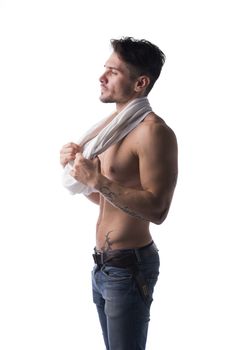 Handsome muscular, shirtless man looking to a side, profile view, isolated on white