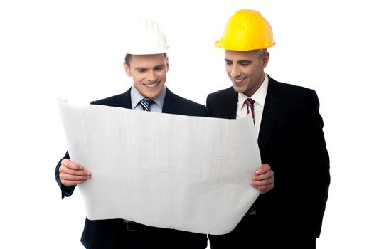Two male architect discussing about project plan