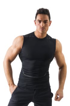 Handsome athletic young man in black t-shirt isolated on white, looking at camera