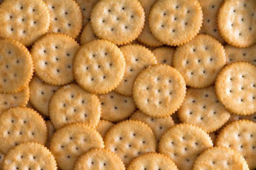 Close up Plenty Salted Toasted Round Crackers for Backgrounds, Captured in High Angle View.