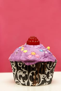 A colorful homebaked cupcake with its feminine touch.