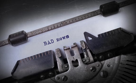 Vintage inscription made by old typewriter, Bad news