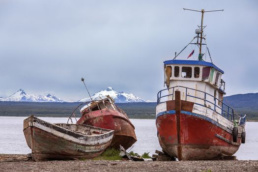 Old abandoned fishing boats near Puerto Natales in Patagonia in southern Chile, South America. Puerto Natales is located at the opening of Ultima Esperanza Sound 247km (153mls) northwest of Punta Arenas.