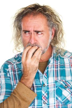 Single isolated man in beard biting fingernails