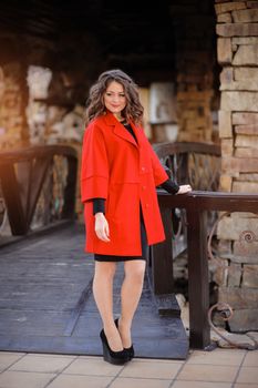 Beautiful elegant woman in a red coat