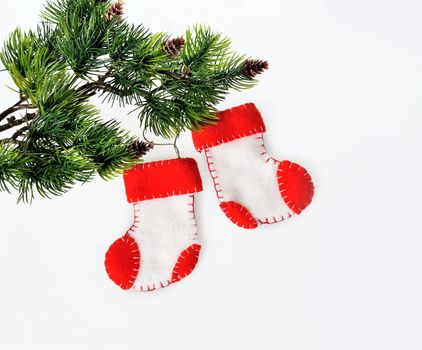 Two Santa's boots on christmas tree