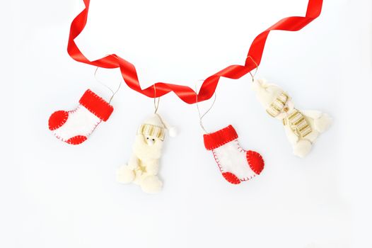 Christmas garland ornament background of boots and a snowman and Santa Claus