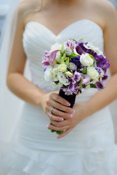 wedding bouquet in hands of the bride