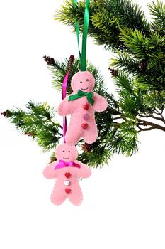 Christmas background with fir-tree branch and pink toys