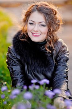 Fashion style photo - gorgeous young woman in grass