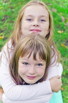 Photo of two cute girls with long hairs