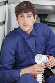 Serious man holding a pipe