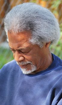 African american male expressions outside alone.