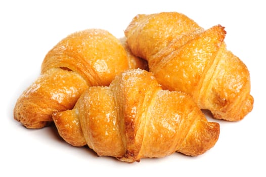 Three fresh just baked croissants on white background, isolated