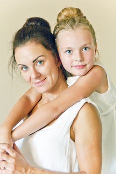 Photo of mother and daughter in white