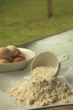 Baking Flour in Outdoor Setting with Eggs