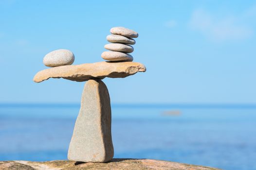 Well-balanced of stones on the top of boulder