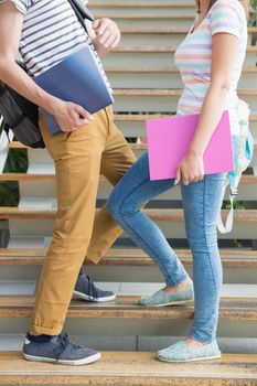 Students standing on steps together at the university