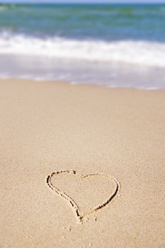 Image of a painted heart in the sand on the beach of the Baltic Sea in Germany