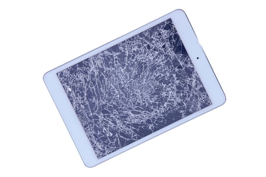 Tablet with a shattered glass screen rendered unusable after an accident or fall viewed isolated on white from above, diagonal with copyspace