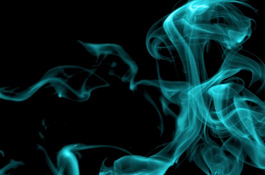 Abstract Turquoise Smoke Figures closeup on Black background