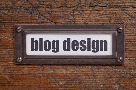 blog design  - file cabinet label, bronze holder against grunge and scratched wood