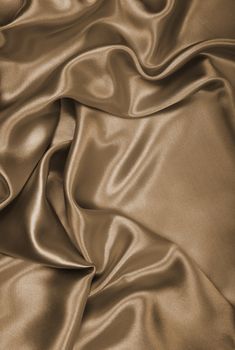 Smooth elegant golden silk or satin can use as wedding background. In Sepia toned. Retro style