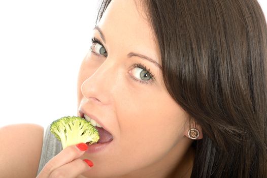Attractive Healthy Young Woman Eating Raw Uncooked Broccoli