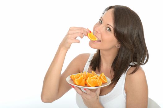 Healthy Happy Young Woman Holding a Plate of Fresh Orange Segments