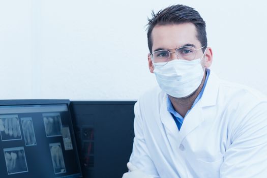 Portrait of male dentist wearing surgical mask