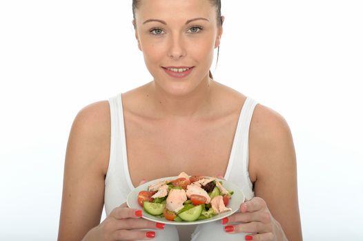 Healthy Happy Young Woman Holding a Plate of Poached Salmon and Mixed Salad