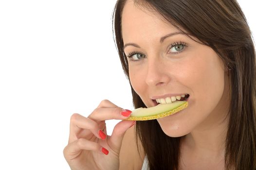 Attractive Healthy Young Woman Eating a Slice of Refreshing Fresh Melon