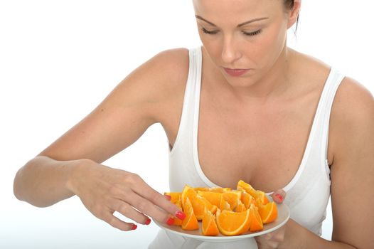 Attractive Happy Healthy Young Woman Holding a Plate of Fresh Cut Oranges