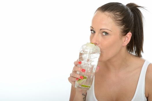 Healthy Happy Attractive Young Woman Holding a Glass of Iced Water with Lime