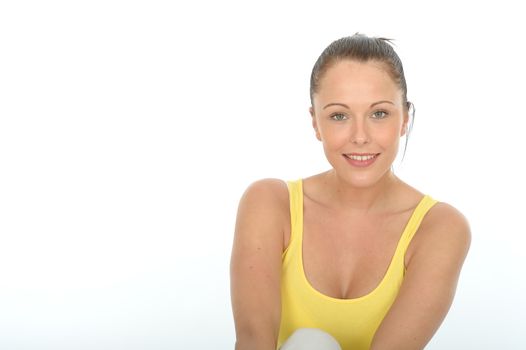 Happy Relaxed Portrait of a Confident Young Woman Facing the Camera Smiling Wearing a Bright Yellow Vest Top.