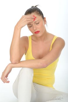 Portrait of a Stressed Young Woman Sitting on the Floor Rubbing Her Forehead