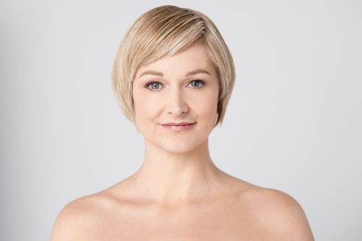 Bare shoulder woman posing to camera