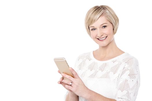 Attractive woman posing with her cellphone